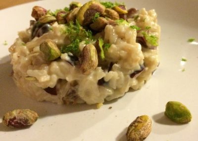 Indian coconut and rum rice pudding with toasted pistachios and lime zest.